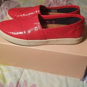 TOMS red vinyl slip ons